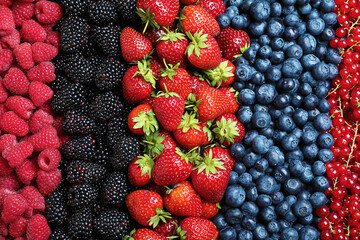 Mix of different ripe tasty berries as background, top view © New Africa