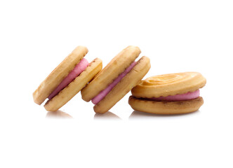 sandwich cookies with strawberry cream on white background