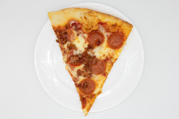 Pepperoni and Bacon Pizza Slice on a White Plate with a White Background