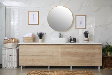 Modern mirror and vessel sink in stylish bathroom. Interior design