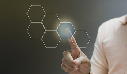 Businessman pointing his finger touch hexagon icon
