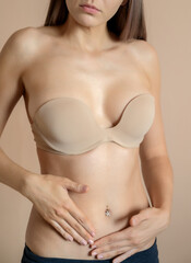 Young woman with fit body, in bra.