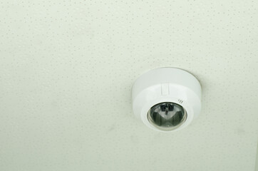 Concept of surveillance and monitoring, modern cctv camera attach to the wall