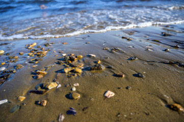 Waves at the seashore. Selective focus with shallow depth of field.