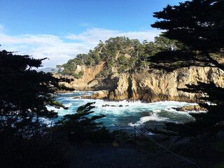 Fototapeta na wymiar Point Lobos Cypress and Swirling Ocean Turquoise Water Coastal California USA, nature, preserve. travel, Monterey. tourism, state park, Pacific Ocean