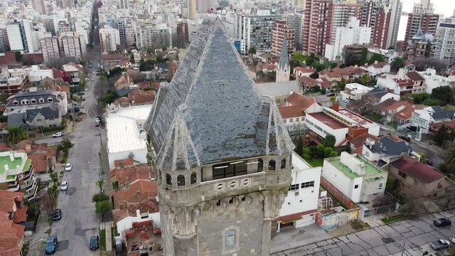 Aerial drone view of old Water Tank tower building called Torre Tanque - one of popular city landmark. Drone fly above old tower. Mar del Plata, Argentina.
