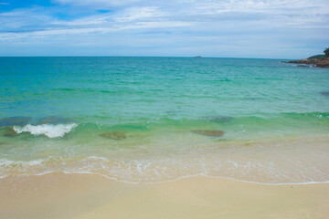 Fototapeta na wymiar Soft Wave Of Blue Ocean On Sandy Beach