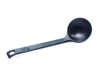 plastic black spoon, isolated on white background