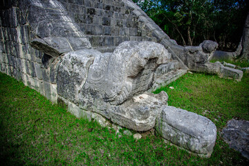 Fototapeta na wymiar Snake Head Monuments At The El Castillo Temple, Chichen Itza, Mexico