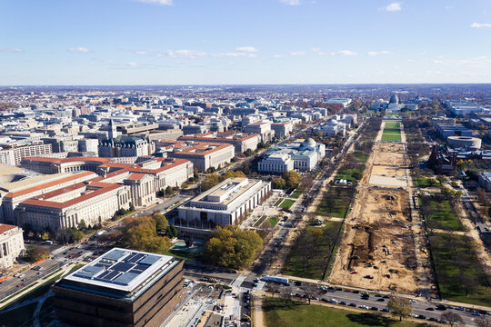 Aerial cityscape of the Mall & Penn Quarter in Washington DC, including the triumphal tree-lined avenue leading up towards the United States Capitol Building & Smithsonian Museums 