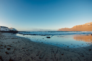 Famara beach and mountains with sunset tones in Lanzarote