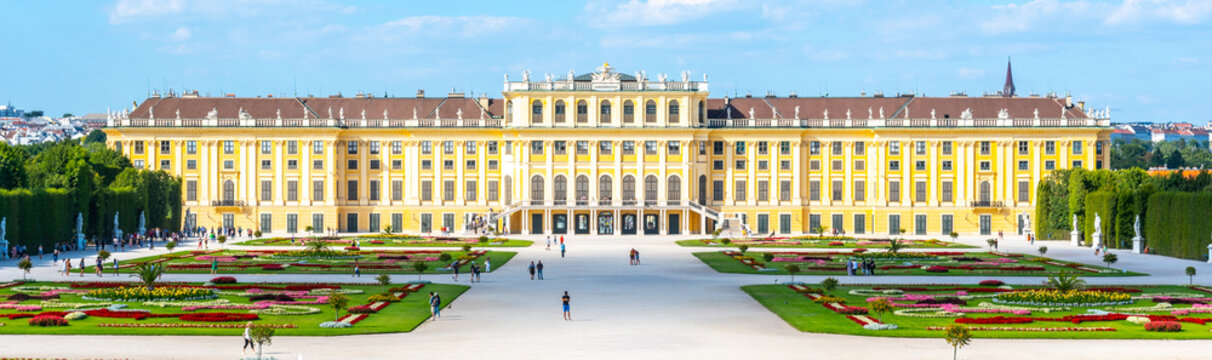 VIENNA, AUSTRIA - 23 JULY, 2019: Schonbrunn Palace, German: Schloss Schonbrunn, and Great Parterre - French Garden with beautiful flower beds, Vienna, Austria.