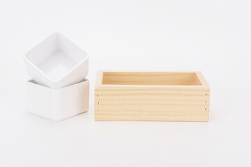 White ceramic teacups and wooden tray together