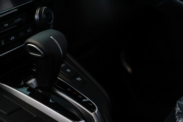 Fototapeta na wymiar Automatic gear stick inside modern sport car. Driving car concept. Safe driving concept.