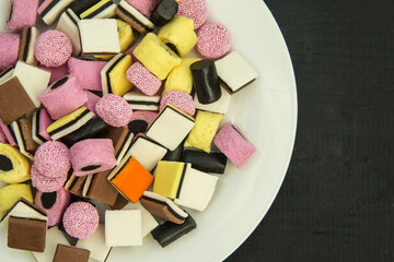 colorful licorice candy on a white board