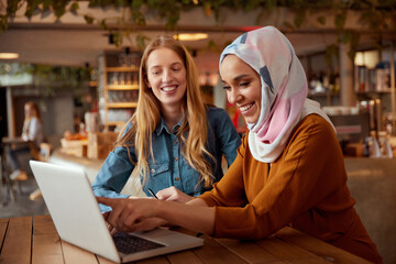 Business. Colleagues Meeting In Cafe. Diversity Ethnic Women. Smiling Girl In Hijab Working On...