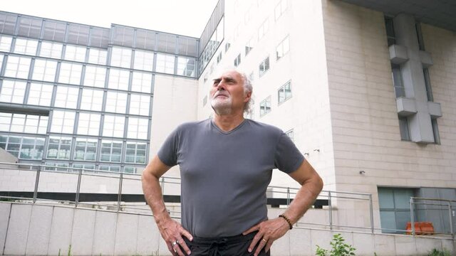 Slow motion shot of senior athletic man looking away