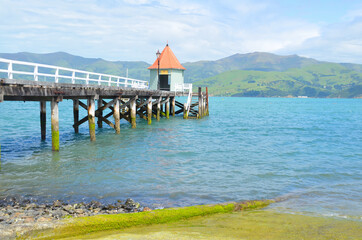 Naklejka premium The most French town in New Zealand, Akaroa will have you entranced with its historic buildings, magnificent harbour and passion for fine food.