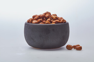 Fava beans (foul) shot on white background.