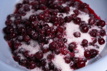 Cooking cherry jam. Cherry sprinkled with sugar
