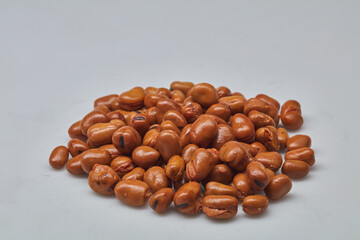 Fava beans (foul) shot on white background.