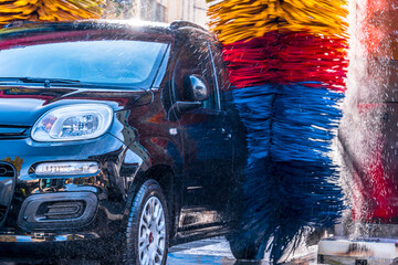 Car going through an automated car wash machine