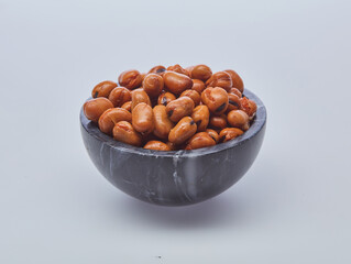 Fava beans (foul) shot on white background.
