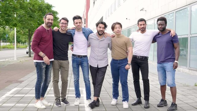 Happy group of best friends standing in a row