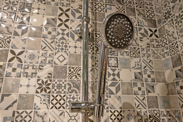 View of the faucet for taking a shower in the bathroom.