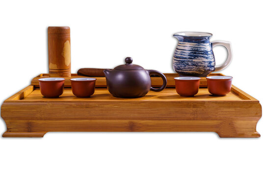 Chinese tea set on the bamboo tray. Isolated on white.