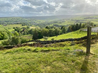 Stormy weather, with the sun breaking through rain clouds near, Haworth, Keighley, UK