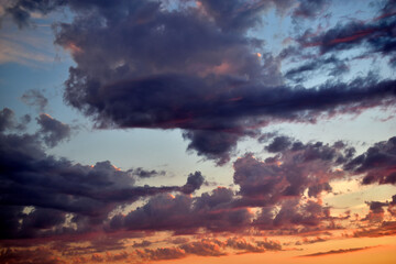 Blue sky with beautiful blue red clouds in the evening