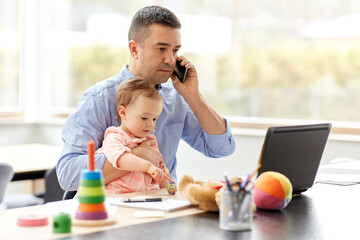 remote job, multi-tasking and family concept - middle-aged father with baby and laptop calling on smartphone at home office