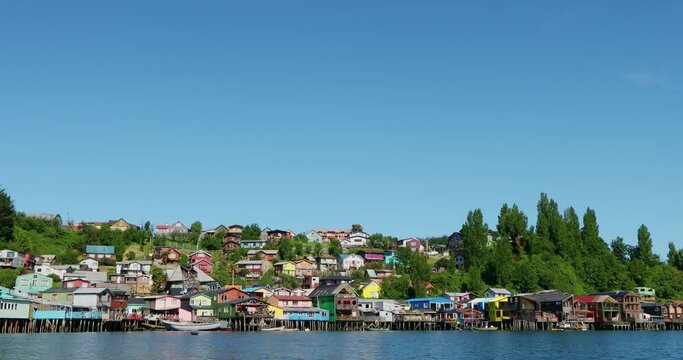 SLO MO WS POV Multicolored palafitos - stilt houses / Castro, Patagonia, Chile