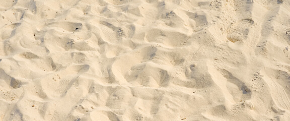 Fototapeta na wymiar summer background with brown sand texture background