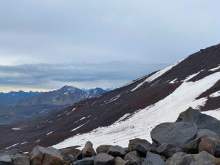 Snowy rocky slopes of the northern Elbrus region. Beautiful winter mountain landscape.