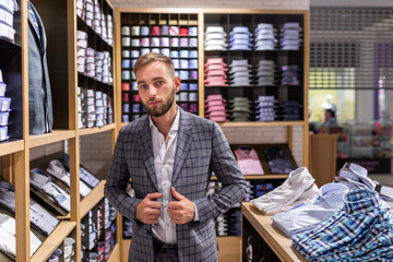 Handsome elegant young fashionable man in a classic suit.