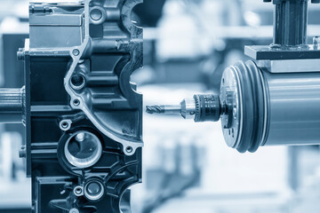 The milling spindle attached with the robotics arm  finishing cut  the  automotive parts by solid end-mill tool. The smart automotive factory use the robotics system for manufacturing process. © Pixel_B