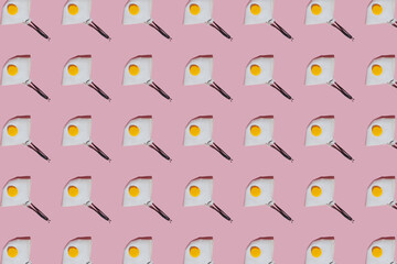 Respirator shaped abstract fried eggs on a pastel background. Pattern