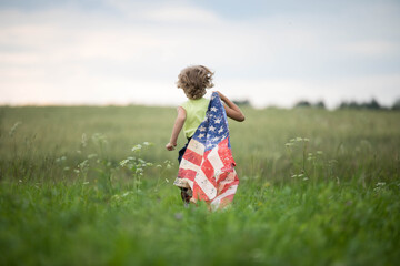 Patriotic holiday. Happy kid, cute little child girl with American flag.