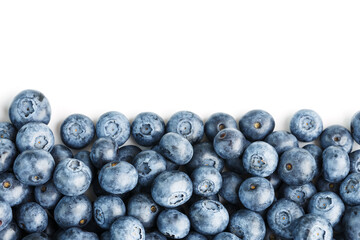 Blueberries are scattered on a white background. Free space, isolate. Studio light.