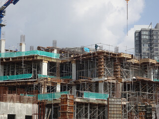 SEREMBAN, MALAYSIA -MARCH 7, 2020: Steel reinforced concrete structure is built at the construction site. Built using formworks made of wood and plywood. Manually build by the workers.