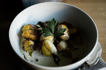 moody gnocci with cheese sauce with herbs and peppers as vegetarian dish to cook by yourself