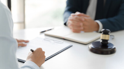 Lawyer consultant team working together with lawsuit.