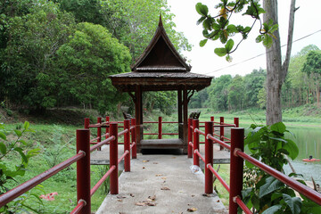 Traditional pavillion on water in Wat Doi Mae Pang, a Buddhist temple in Phrao district, Chiang Mai Province, northern Thailand.