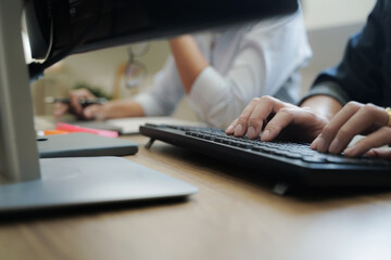 Two college students doing homework together at cafe.