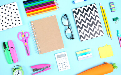 School supplies accessories top view on blue background,back to school objects.