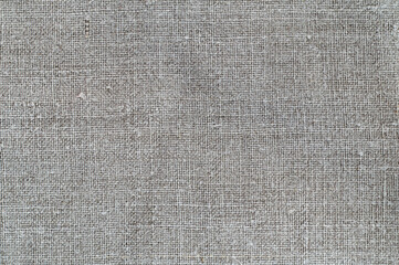 Fototapeta na wymiar Texture of old homespun linen fabric. Rough textile