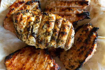 Close up shot of tasty grilled meat with herbs seasoning. Homemade delicious meal.