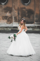 Fototapeta premium Beautiful fashion bride in wedding dress posing
